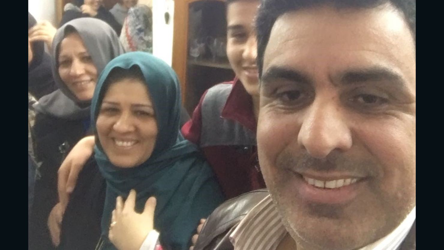 Afrah Shawqi al-Qaisi, wearing a blue scarf, is back home with her family, her sister says