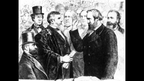 Chief Justice Morrison R. Waite administers the oath of office to Rutherford B. Hayes. The usual inauguration day back then, March 4, fell on a Sunday in 1877. So the public ceremony was held on a Monday.