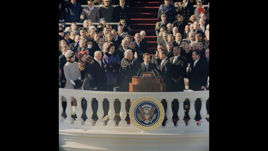 John F. Kennedy is sworn in by Chief Justice Earl Warren in 1961. Kennedy, at 43, was the youngest ever to be elected president. This was the first inauguration ceremony to be televised in color.
