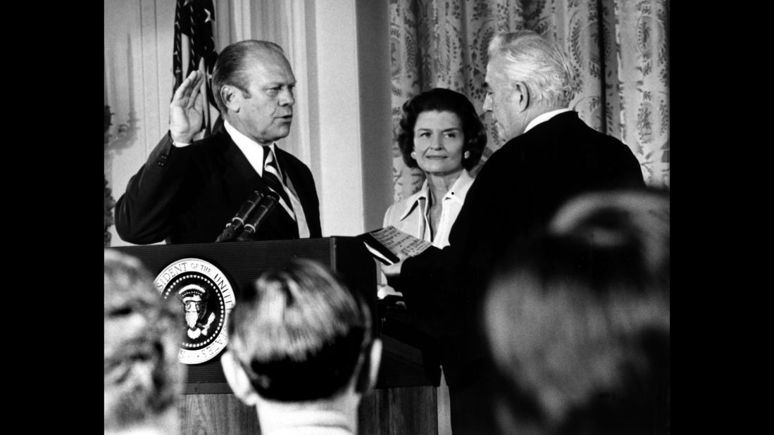 Gerald Ford takes the oath in 1974 next to his wife, Betty. He became president in August of that year after Richard Nixon resigned because of the Watergate scandal.
