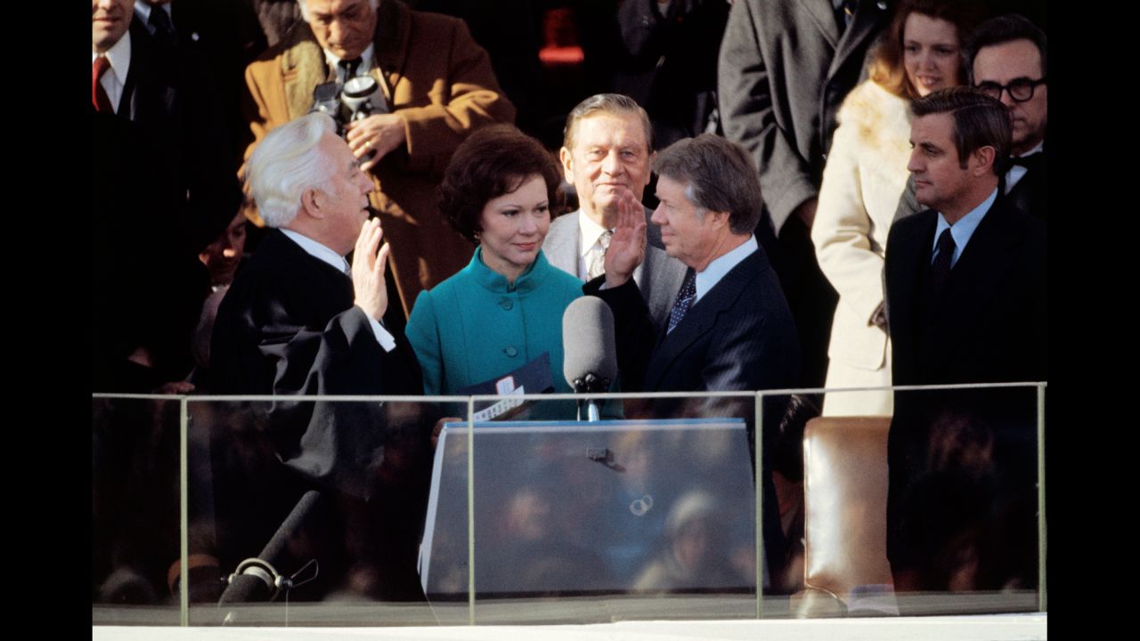 Jimmy Carter is joined by his wife, Rosalynn, as he takes the oath of office in 1977. He was the first president to walk from the Capitol to the White House in the post-inauguration parade.