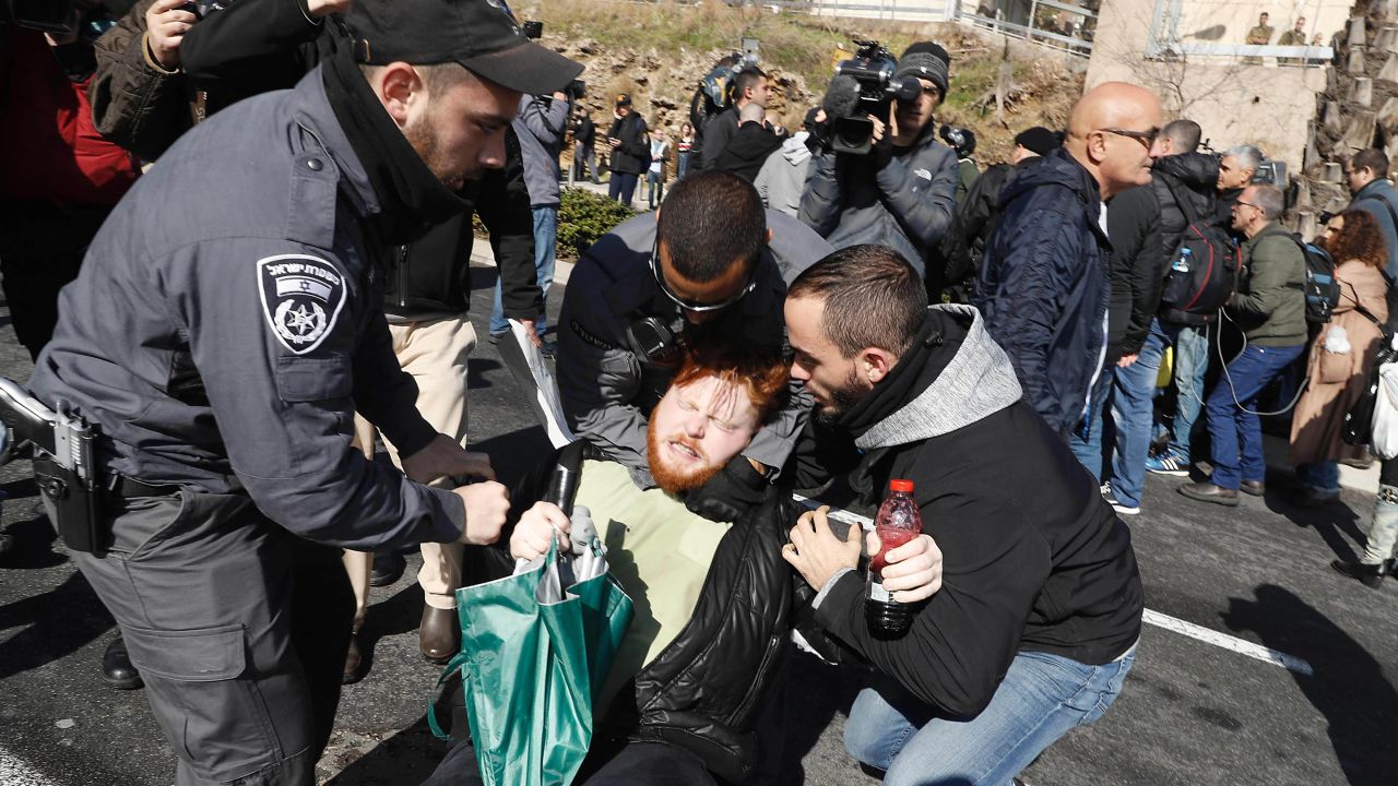 Police detain an Azaria supporter protesting Wednesday outside the Ministry of Defense in Tel Aviv.