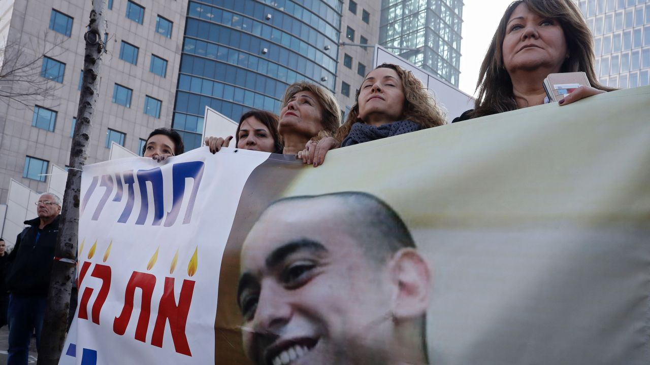 Israeli women protest Wednesday outside the Ministry of Defense in Tel Aviv in support of Azaria.