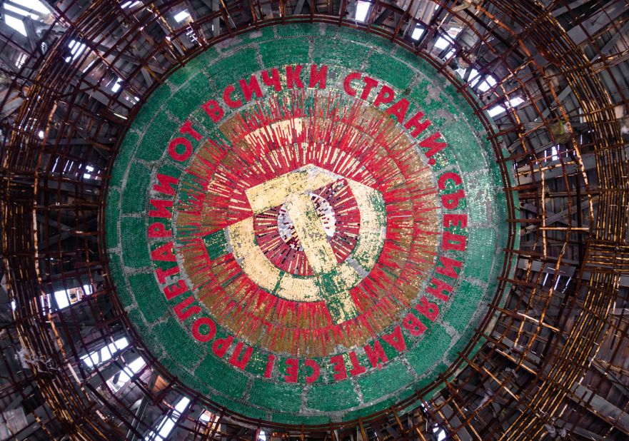 <strong>Soviet symbols: </strong>The enormous hammer and sickle mosaic is in the center of the ceiling and has managed to stay intact since the monument's closure. The script around the edge declares the Soviet Union's state motto, "Workers of the world, unite!"<br />