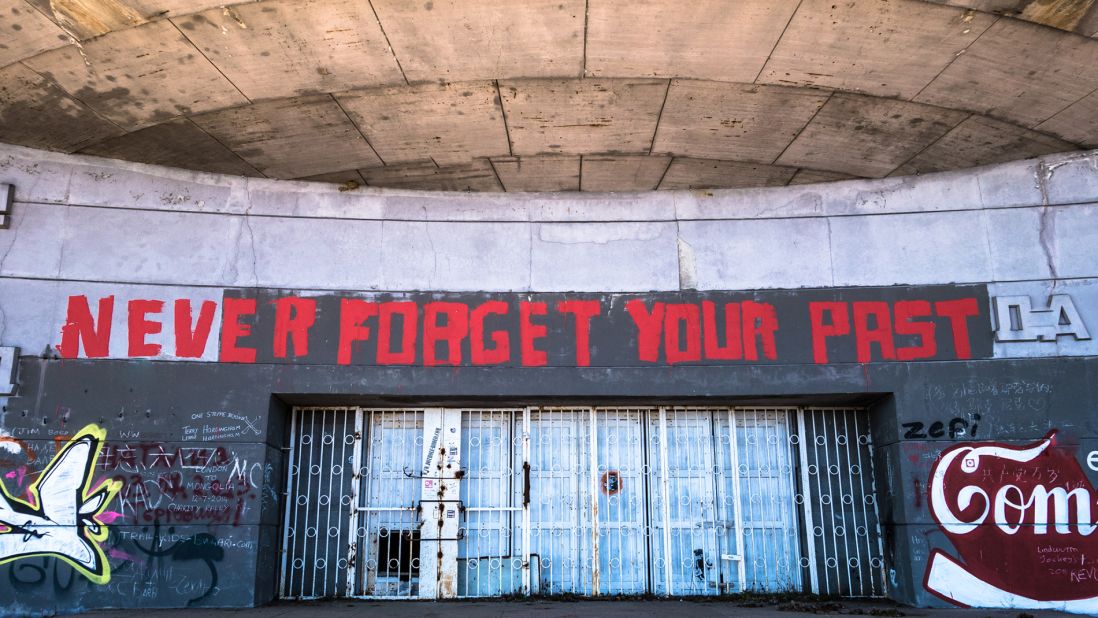 <strong>Graffiti gate: </strong>Above the locked entrance, graffiti declaring "never forget your past" is a somber reminder of the Balkans' recent history. <br />