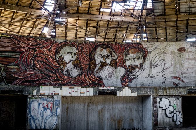 <strong>Communist tributes: </strong>Mosaic images of Engels, Marx and Lenin watch over the hall.