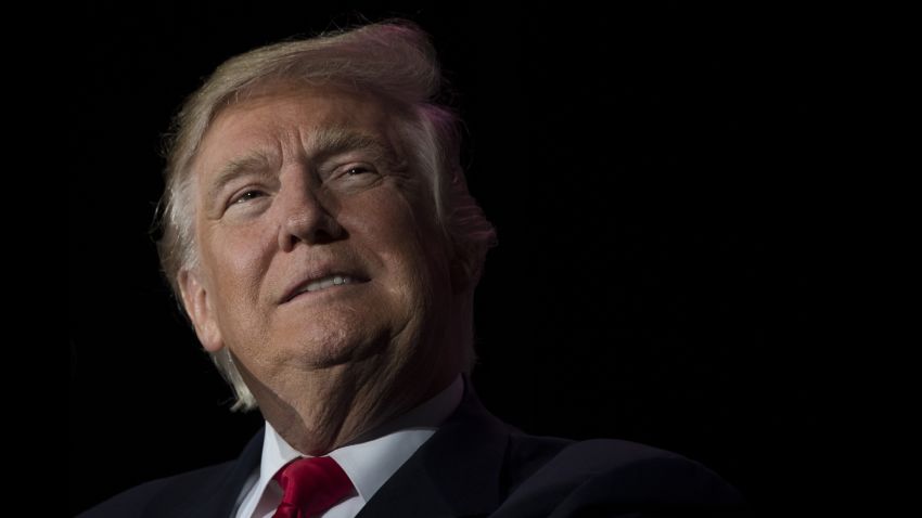 US President-elect Donald Trump looks on while speaking during a 'Thank You Tour 2016' rally in Orlando, Florida on December 16, 2016. / AFP / JIM WATSON        (Photo credit should read JIM WATSON/AFP/Getty Images)