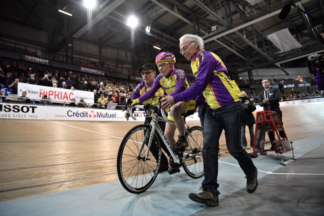 Marchand starts to ride in his attempt to set a one-hour track cycling world record in the over-105 age group.