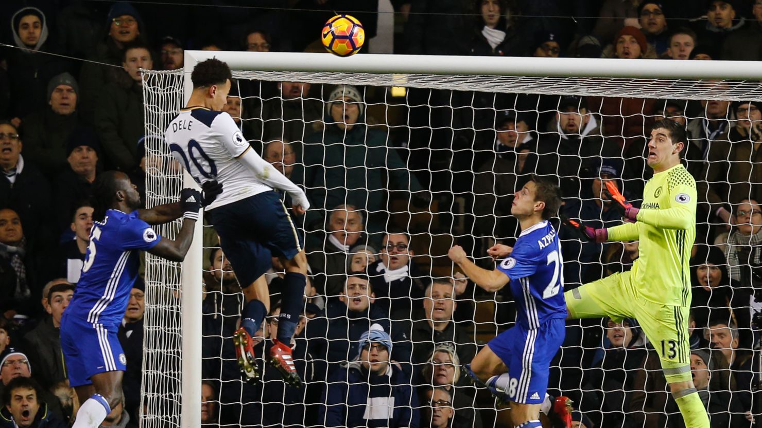 Dele Alli jumps to score his and Tottenham's second goal against Chelsea.