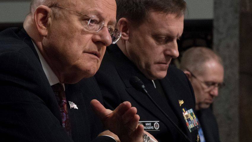 Director of National Intelligence James Clapper (L) and National Security Agency Director Adm. Michael Rogers (C) testify before the Senate Armed Services Committee on Capitol Hill in Washington, DC, January 5, 2017. / AFP / JIM WATSON        (Photo credit should read JIM WATSON/AFP/Getty Images)