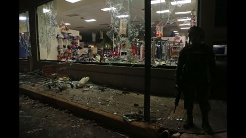 Military police secure a store after it was looted during a protest in the port of Veracruz, Mexico, on Wednesday.