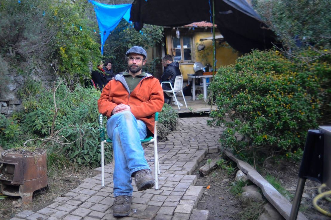 Olive and poultry farmer Cedric Herrou hosted migrants in caravans and tents on his property.
