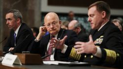 U.S. Cyber Command Commander, National Security Agency Director, Central Security Services Chief Adm. Michael Rogers, right, accompanied by Director of National Intelligence James Clapper, center, and Defense Undersecretary for Intelligence Marcel Lettre II, testifies on Capitol Hill on January 5, 2017, before the Senate Armed Services Committee hearing: "Foreign Cyber Threats to the United States." 