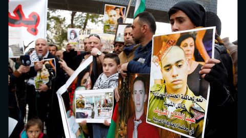 HEBRON, WEST BANK - JANUARY 4: Palestinians hold posters as they gather in Hebron, on January 4, 2017, during the trial of Israeli soldier Elor Azaria.
