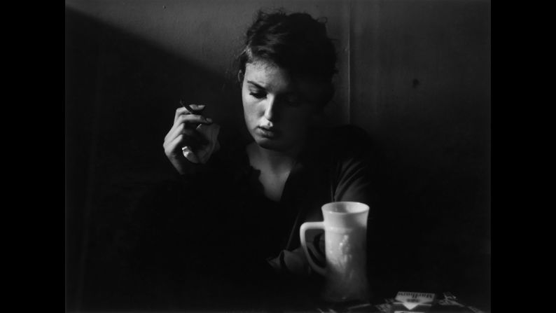 Poet Janine Pommy Vega sits inside the 7 Arts Coffee Gallery in 1957.