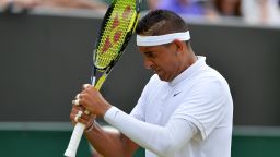 Australia's Nick Kyrgios hits himself on the head with his racket during his men's singles third round match against Canada's Milos Raonic on day five of the 2015 Wimbledon Championships at The All England Tennis Club in Wimbledon, southwest London, on July 3, 2015.   RESTRICTED TO EDITORIAL USE  --  AFP PHOTO / GLYN KIRK        (Photo credit should read GLYN KIRK/AFP/Getty Images)