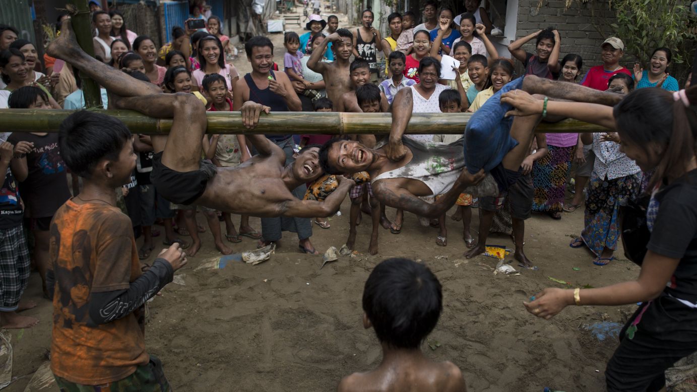 Young men in Yangon, Myanmar, engage in a traditional pillow fight game during Independence Day festivities on Wednesday, January 4.
