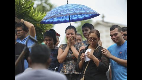 Relatives cry during the burial of an inmate killed in a prison riot in Manaus, Brazil on January 4. 