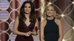 Hosts Tina Fey and Amy Poehler speak onstage during the 71st Annual Golden Globe Award at The Beverly Hilton Hotel on January 12, 2014 in Beverly Hills, California.  
