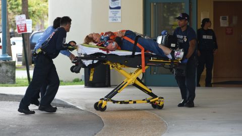 A shooting victim is taken into Broward Health trauma center in Fort Lauderdale. Eight people were being treated there after they were injured at the airport, officials said.