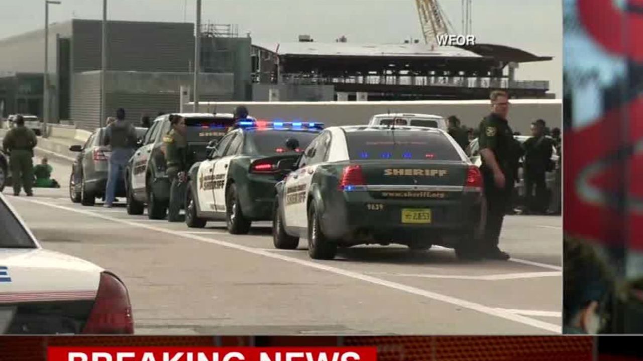 Sources Shooter had gun in checked bag CNN
