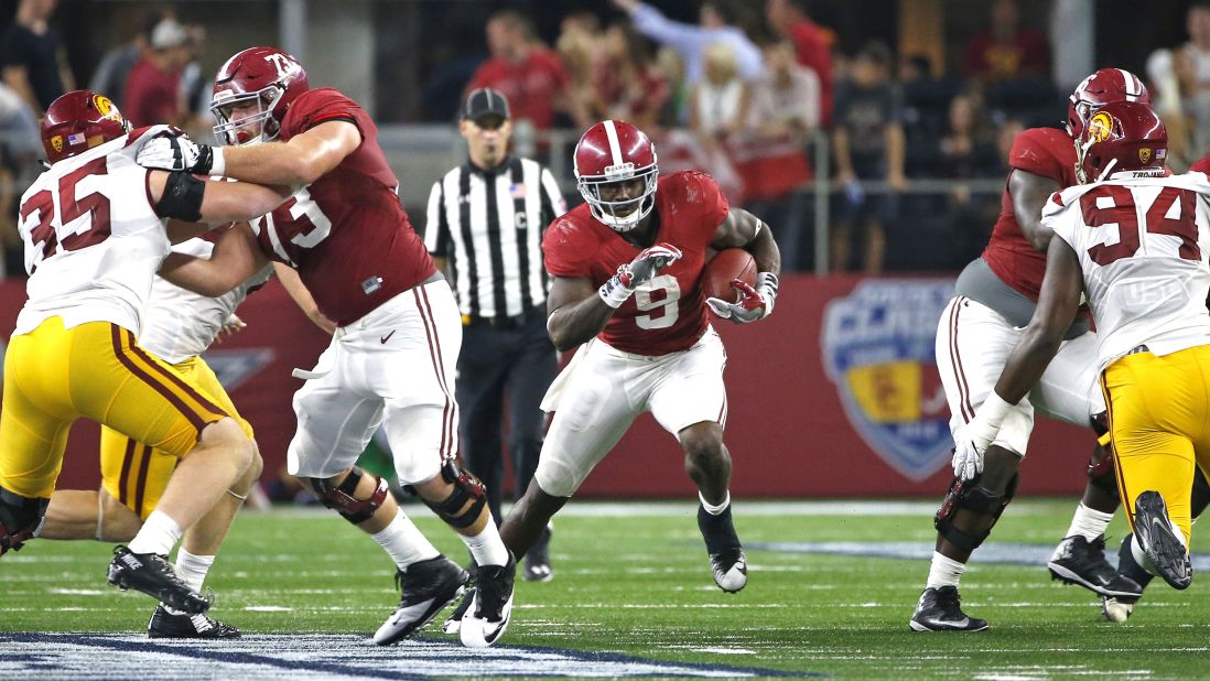 Alabama running back Bo Scarbrough, center, makes his way against the Southern California Trojans in the AdvoCare Classic on September 3 in Arlington, Texas. 