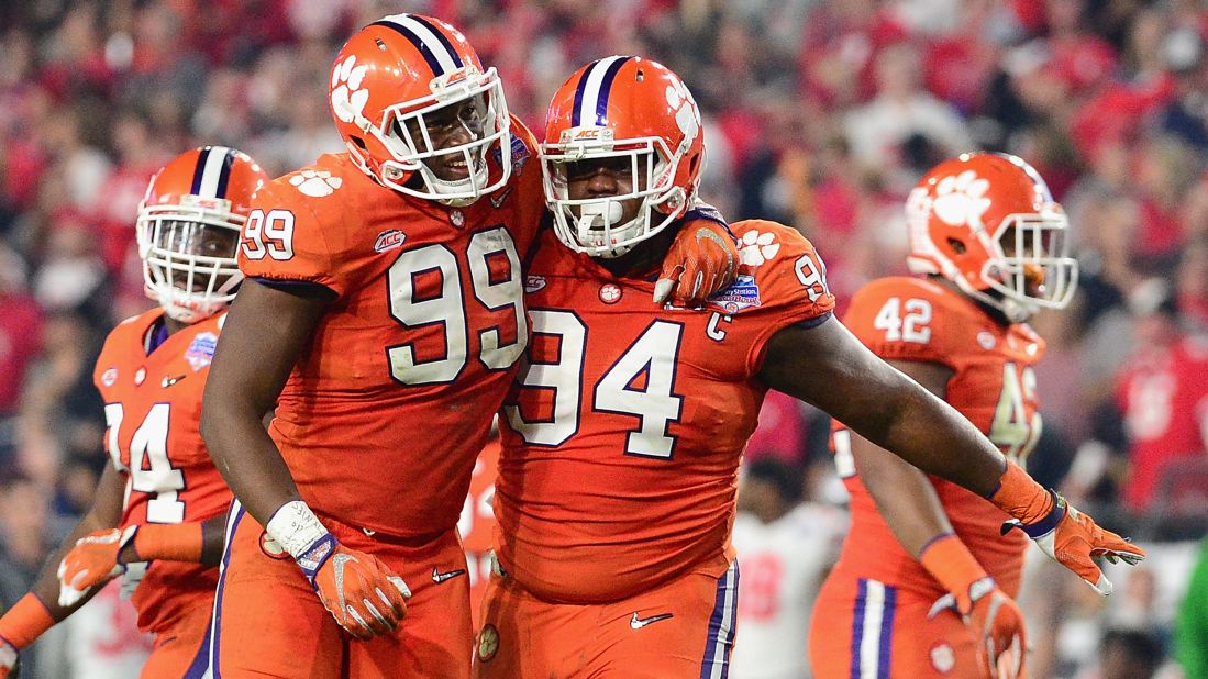 Clemson's Clelin Ferrell, left, celebrates with teammate Carlos Watkins during the  PlayStation Fiesta Bowl.