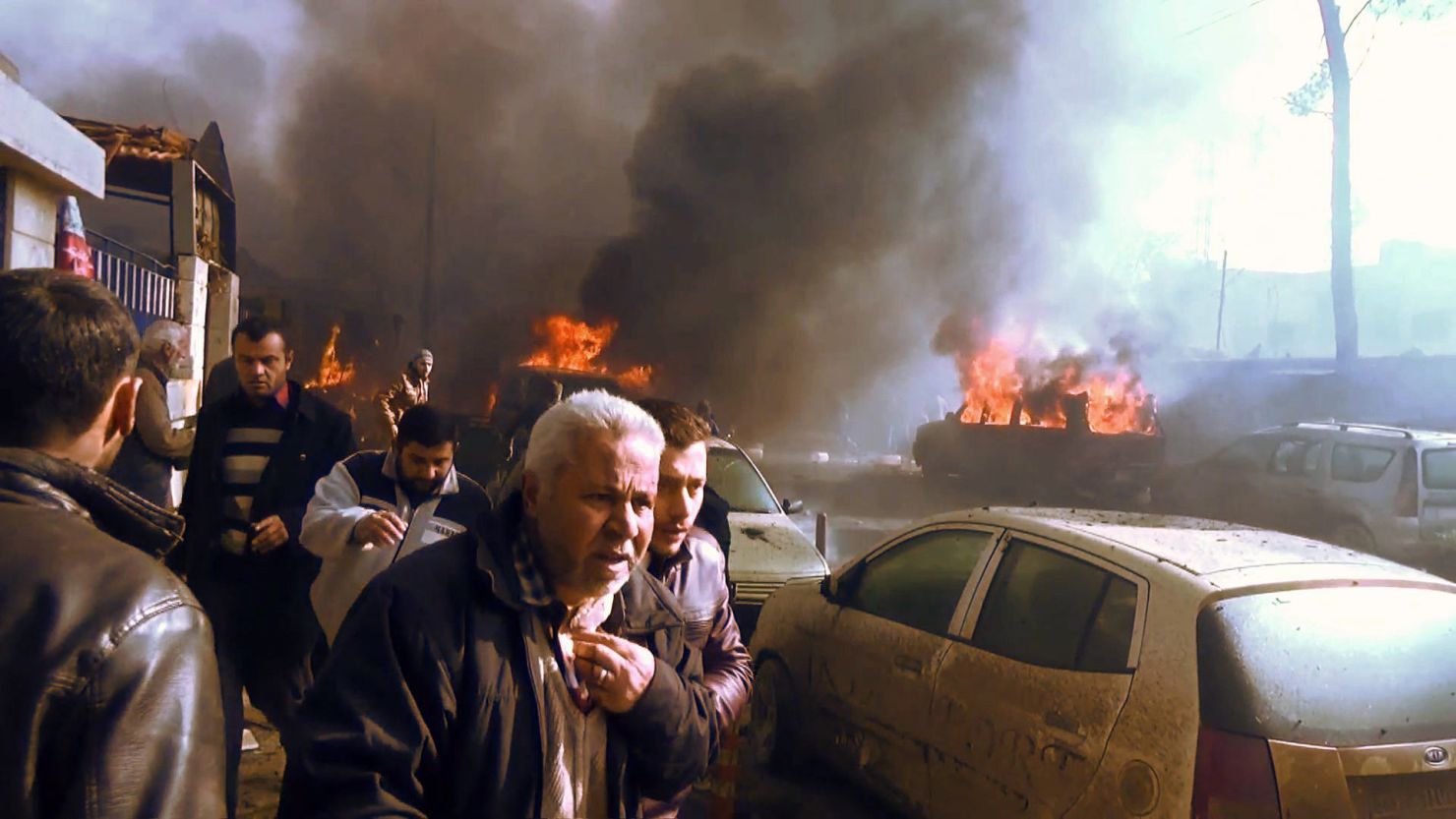 A crowd gathers Saturday after a car bomb attack in Azaz, Syria, in an image taken from AFPTV footage.