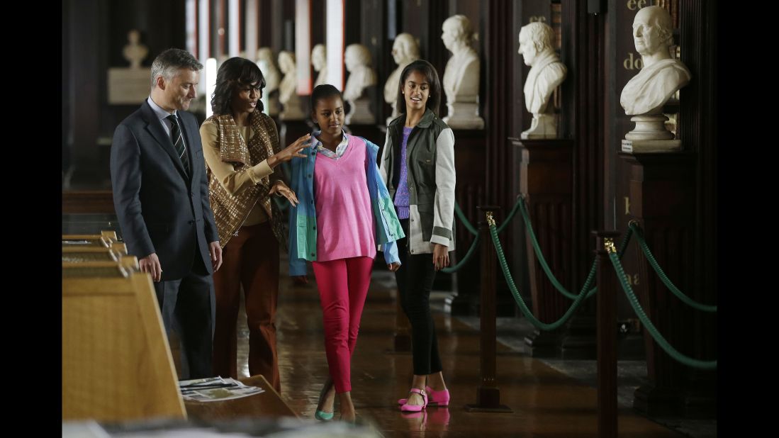 The first lady and her daughters receive an escort from Patrick Prendergast, provost and president of Trinity College Dublin, during their June 2013 visit to Ireland. 