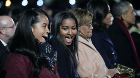 Malia and Sasha Obama, grandmother Marian Robinson, the first lady and President attend the National Christmas Tree lighting ceremony on the Ellipse south of the White House in December 2015. 