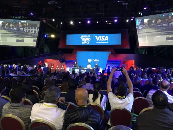 A capacity crowd crammed into Las Vegas' Venetian Hotel to watch the race which pitted 20 professional Formula E drivers against 10 eSports fanatics.