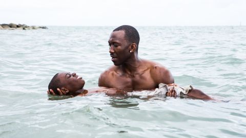 Alex Hibbert and Mahershala Ali in "Moonlight," a 2016 film about a Black boy coming to terms with his sexuality in Miami.