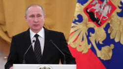 Russian President Vladimir Putin delivers a speech during a reception dedicated to the celebration of the New Year at the Kremlin in Moscow on December 28, 2016.