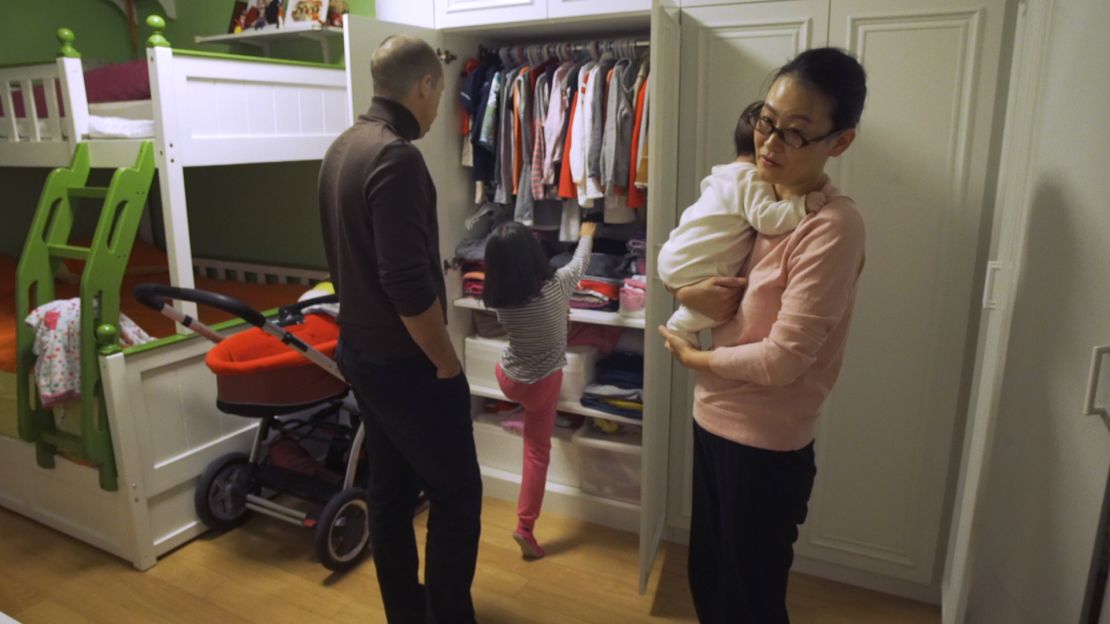 Jiang Wang, her husband Ludovic Bodin and her two daughters, 6-year-old Mia and 3-month-old Anna.