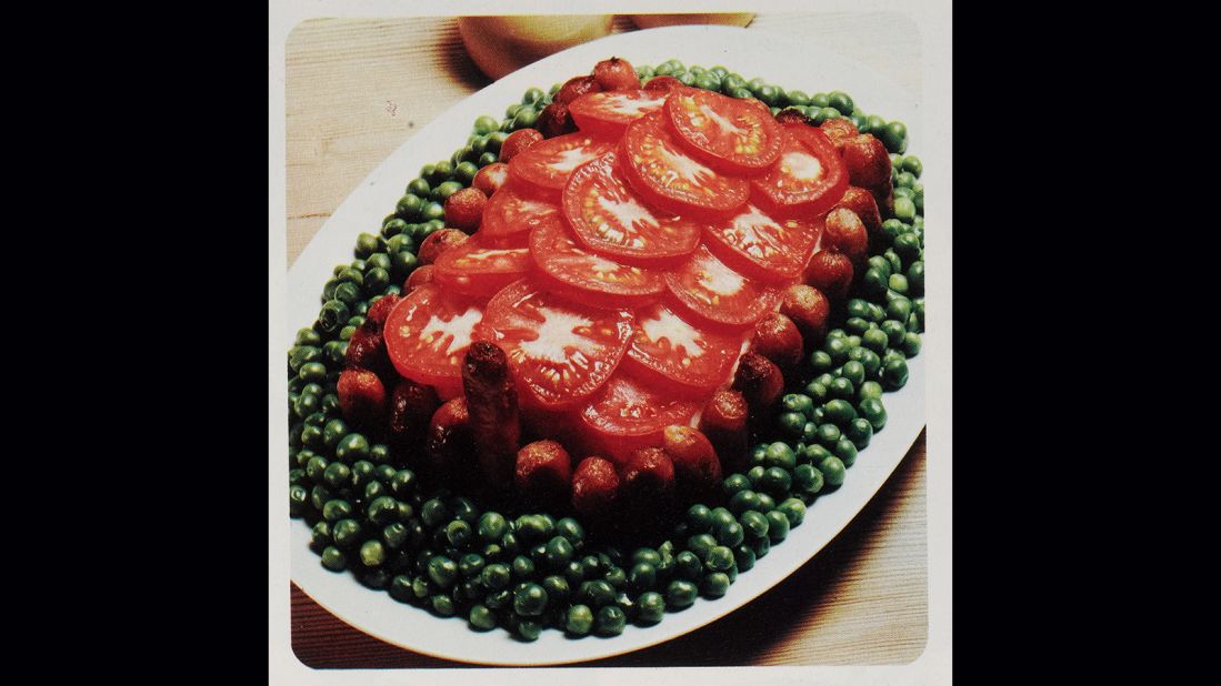 <strong>Tomatoes, sausages and peas --</strong> To a British public as yet unaccustomed to fresh salads, some well-placed sausages provide reassurance that it is indeed a proper dinner. 