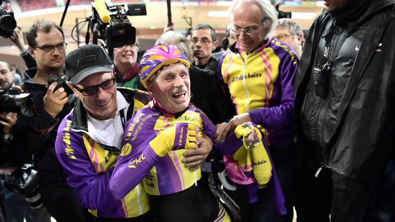 Robert Marchand, 105, reacts after setting a track cycling record for his age group on Wednesday, January 4. Marchand rode 22.547 kilometers (14.010 miles) in an hour.