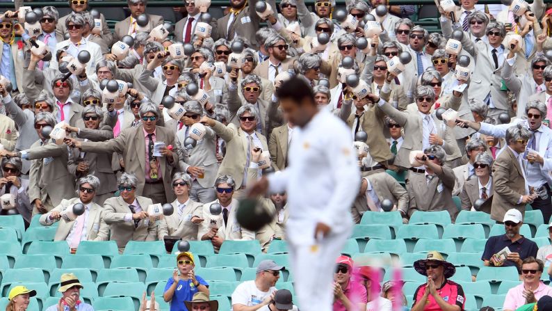 Cricket fans dressed as commentator Richie Benaud cheer on Australia during a Test match against Pakistan on Wednesday, January 4.