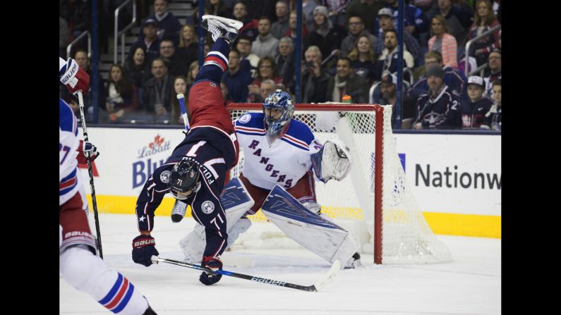 Columbus forward Nick Foligno is upended during an NHL game against the New York Rangers on Saturday, January 7. Columbus won 16 straight games this season -- one short of the NHL record.