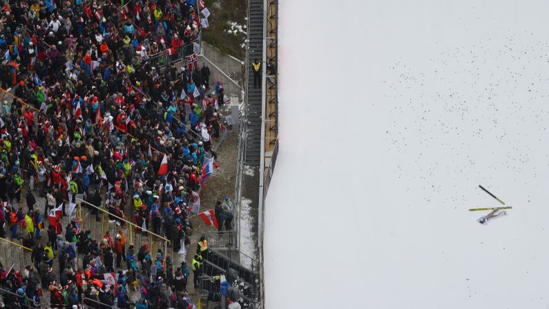 Polish ski jumper Kamil Stoch lies in the snow after crashing Wednesday, January 4, in Innsbruck, Austria. Stoch went on to win the Four Hills Tournament. 
