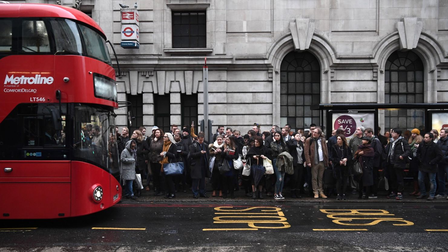 Commuters line up for buses in central London on Monday during a 24-hour Tube strike. 