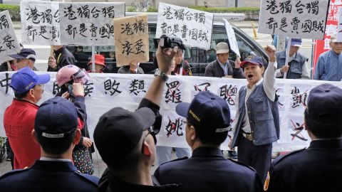 Pro-China protesters waving placards reading "independence will get you nowhere" greeted Hong Kong pro-democracy activist Joshua Wong and other lawmakers in Taipei.