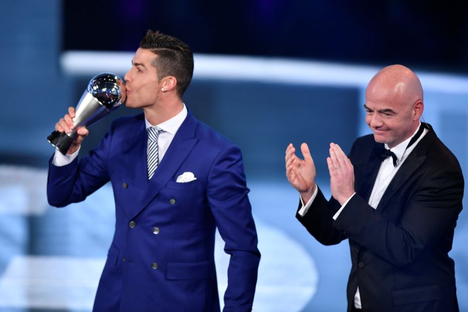 The Real Madrid and Portugal forward accepted his award from FIFA president Gianni Infantino after beating Lionel Messi and Antoine Griezmann in the vote.