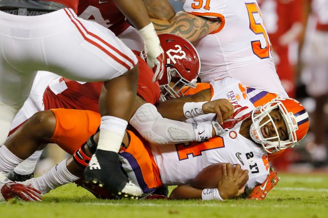 Anderson tackles Watson in the first half.