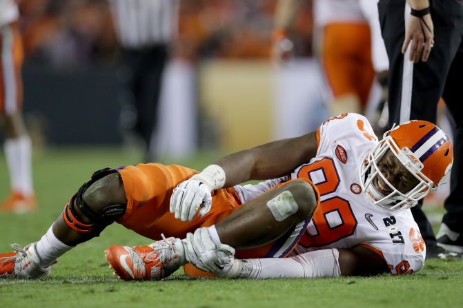 Clemson defensive end Clelin Ferrell holds his ankle after spraining it in the third quarter. He was unable to return to the game.