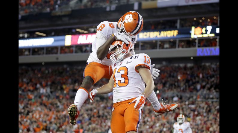 Clemson wide receiver Deon Cain, left, celebrates with Renfrow after Renfrow's 24-yard touchdown catch in the third quarter. Clemson cut the Alabama lead to 17-14.
