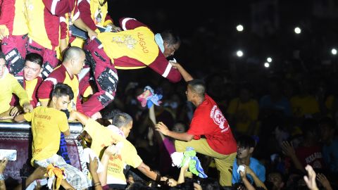 Traslacion participants jostle through the crowds as they try to touch and kiss the Black Nazarene on Monday, July 9.
