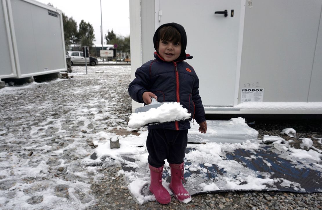 A child plays in the snow at the Kara Tepe camp on the island of Lesbos following heavy snowfalls.