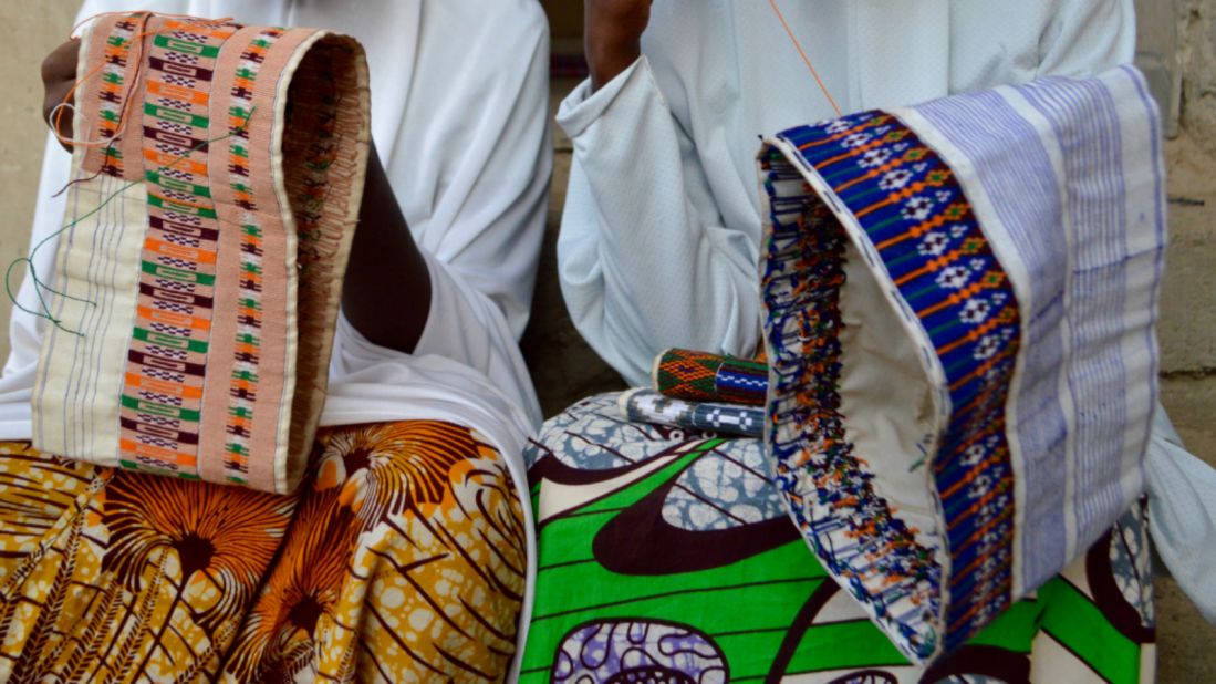 Others pass the time with embroidery. Fatmata (right), 22, was forced to flee at 5am on a Monday morning when Boko Haram attacked her village. "They started shooting guns and killing people. We ran and ran through the bush and on Tuesday, we reached Maiduguri (about 80 km away)," she told IOM.