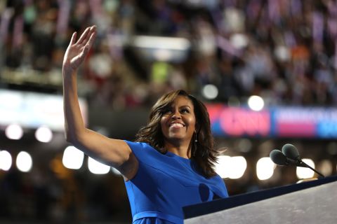 Obama waves to the crowd before giving a speech at the 2016 Democratic National Convention, during which she says one of her most famous quotes: "Our motto is, when they go low, we go high."
