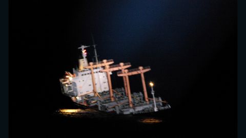 Blurry images show the ship listing.